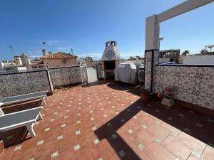 Holiday home with large roof terrace near La Mata beach
