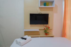 Tranquil Studio at Vida View Makassar Apartment By Travelio