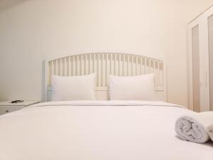 Cozy and High Floor Studio Room at Vida View Makassar Apartment By Travelio