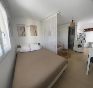 Appartements Tiny house a 50m de la plage de Miomo : photos des chambres