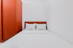 Warm and Minimalist 2BR at Serpong Garden Apartment By Travelio