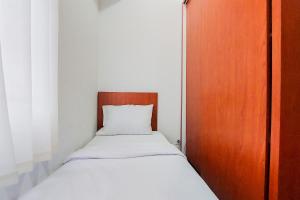 Warm and Minimalist 2BR at Serpong Garden Apartment By Travelio