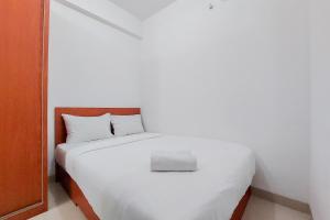 Warm and Minimalist 2BR at Serpong Garden Apartment By Travelio