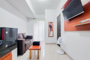 Warm and Minimalist 2BR at Serpong Garden Apartment By Travelio