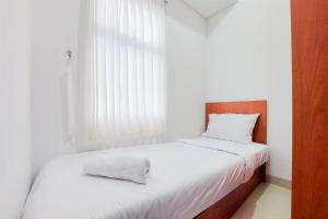 Warm and Minimalist 2BR at Serpong Garden Apartment By Travelio