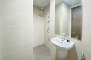 Cozy and Minimalist Studio Room Ciputra International Apartment By Travelio