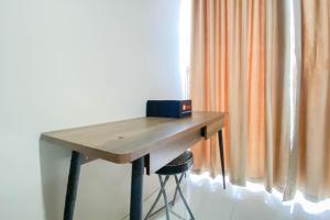 Cozy and Minimalist Studio Room Ciputra International Apartment By Travelio