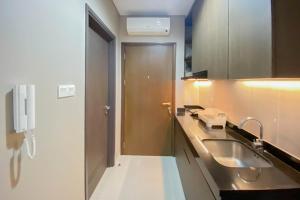Cozy and Minimalist Studio Room Ciputra International Apartment By Travelio