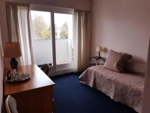 Appartements Appartement avec jardin et Tennis : photos des chambres