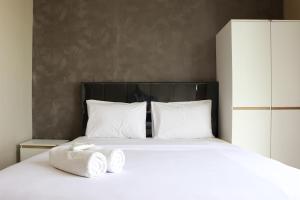 Spacious and Comfy 3BR Ciputra International Apartment By Travelio