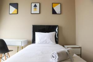 Spacious and Comfy 3BR Ciputra International Apartment By Travelio