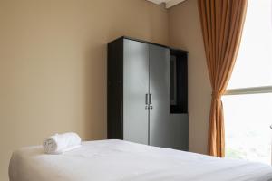 Spacious and Comfy 3BR Ciputra International Apartment By Travelio