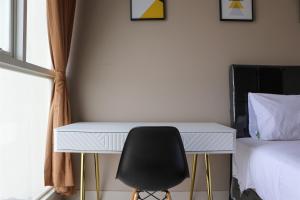 Spacious and Comfy 3BR Ciputra International Apartment By Travelio