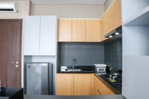 Wonderful and Homey 1BR Ciputra International Apartment By Travelio