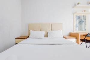 Homey and Elegant Studio Amazana Serpong Apartment By Travelio