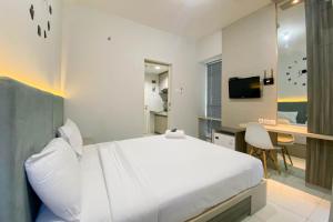 Comfortable 1BR without Living Room at Amartha View Apartment By Travelio