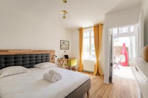 Appartements Maison cosy avec terrasse a 15 minutes de Lyon et WIFI : photos des chambres