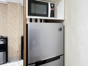 Cozy 2BR Apt Trivium Cikarang with Pool, Gym, WiFi by 2ndHome