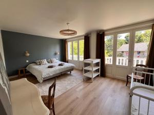 Sejours chez l'habitant L-Ecrin de Famille Maison Mer & Bourg Gold Beach : photos des chambres