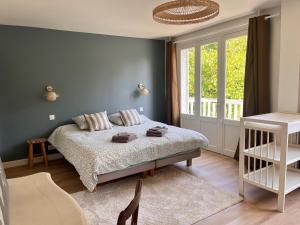 Sejours chez l'habitant L-Ecrin de Famille Maison Mer & Bourg Gold Beach : photos des chambres