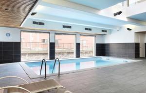 Appartements Studio Harmonie Confluence Lyon City et piscine chauffante : photos des chambres