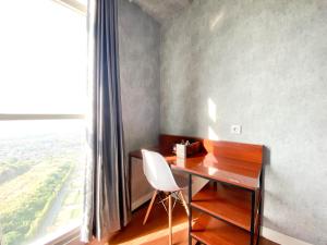 Homey and Good Choice Studio at Amartha View Apartment By Travelio