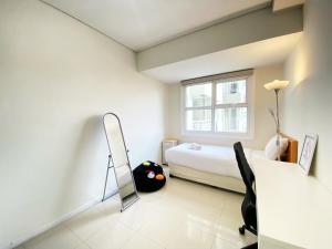Pleasant 2BR at Apartment at Parahyangan Residence By Travelio