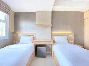 Modest 2BR Apartment at Parahyangan Residence By Travelio