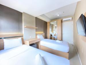 Modest 2BR Apartment at Parahyangan Residence By Travelio