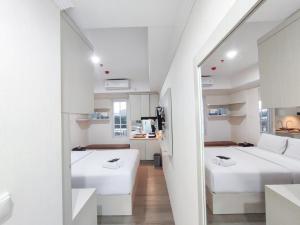 Warm and Cozy Style Studio Room at Paltrow City Apartment By Travelio