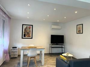 Appartements Maison de village, garage & climatisation : photos des chambres
