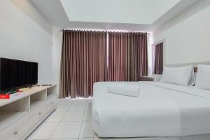 Homey and Best Choice Studio 16th Floor Casa De Parco Apartment By Travelio