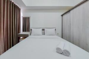 Homey and Best Choice Studio 16th Floor Casa De Parco Apartment By Travelio