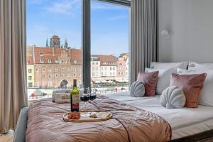 Deo Plaza Riverside & Radisson SPA by Downtown Apartments