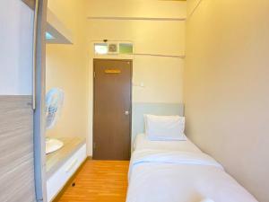 Simply Homey 2BR at Suites @Metro Apartment By Travelio