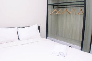 Homey and Minimalist Studio at Vasanta Innopark Apartment By Travelio