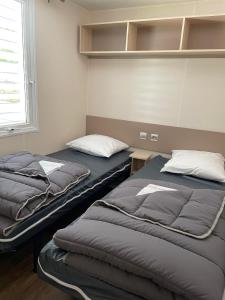 Maisons de vacances Le Riesling - Mobilhome pour 6 - TV - Climatise : photos des chambres