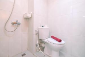 Simply Look Studio at Evenciio Margonda Apartment By Travelio