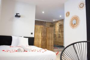 Appartements Escapade Suite : photos des chambres