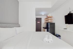 Fully Furnished and Homey Studio Serpong Garden Apartment By Travelio