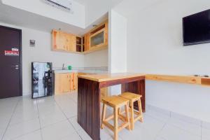 Nice and Comfy 1BR at Casa De Parco Apartment By Travelio