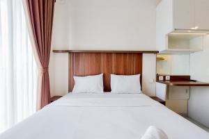Cozy and Nice Studio Apartment at Sky House BSD By Travelio