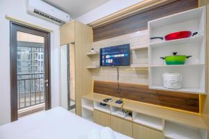 Good Choice and Restful Studio at Transpark Cibubur Apartment near Mall By Travelio