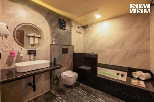 StayVista at Wildwoods Stone with Pool, Bathtub, Wi-Fi