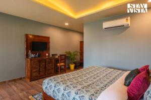 StayVista at Wildwoods Stone with Pool, Bathtub, Wi-Fi