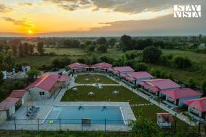 StayVista at Wildwoods Stone with Pool, Bathtub, Wi-Fi