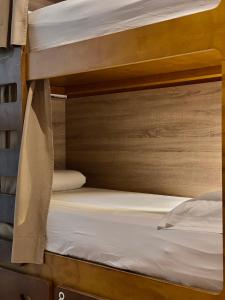 Bed in 8-Bed Dormitory Room with Bathroom room in La Banda Rooftop Hostel