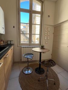 Appartements -Petit Beguin- au coeur d-Uzes : photos des chambres