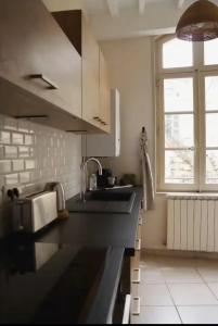 Appartements -Petit Beguin- au coeur d-Uzes : photos des chambres