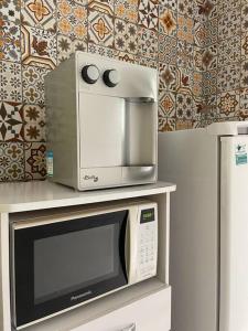 Apto em condomínio com praia em Angra com piscina, sauna e garagem